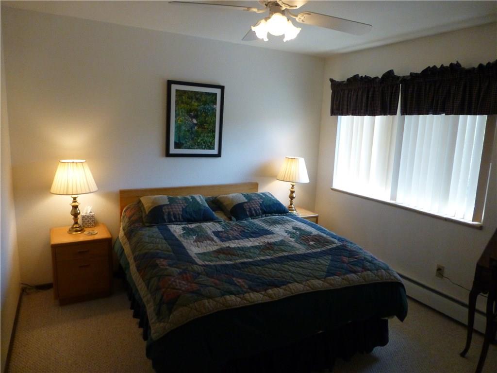 110 Evergreen Road, Unit B303 Dillon, CO 80435 - Photo 16 of 21 a bedroom with a bed and a window