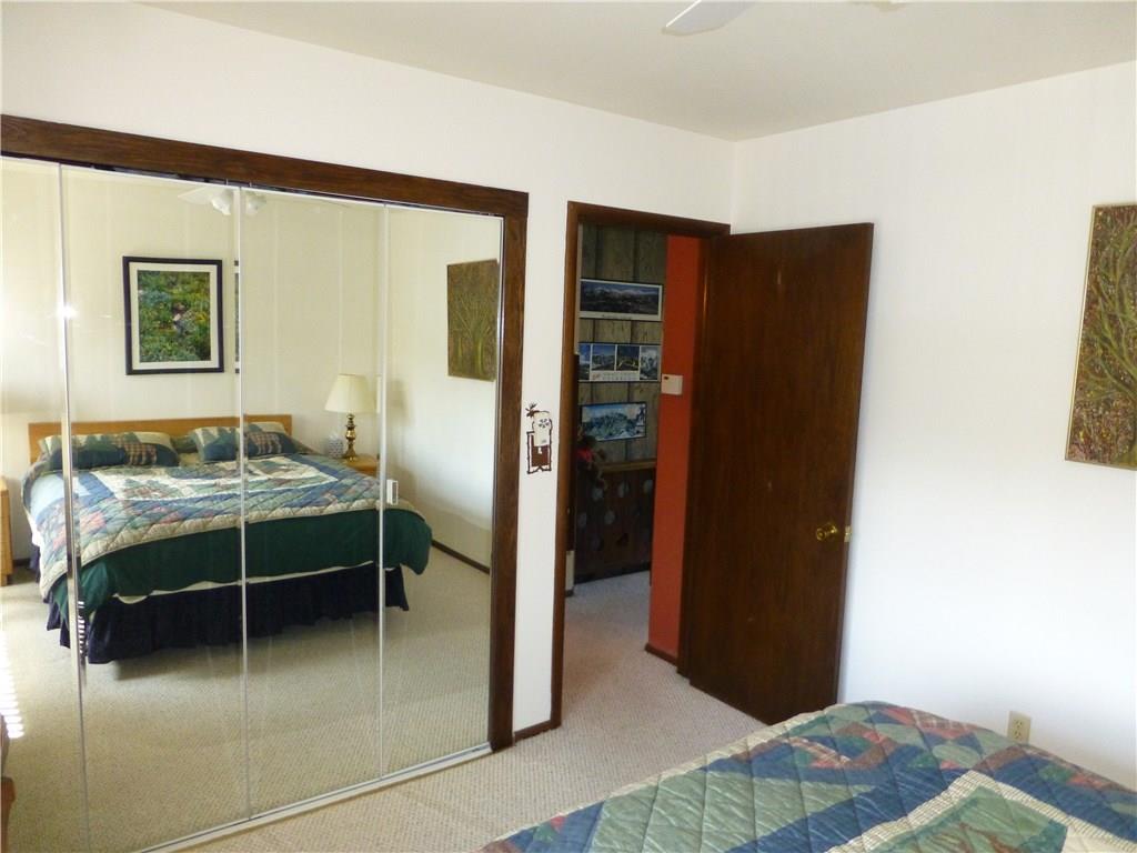 110 Evergreen Road, Unit B303 Dillon, CO 80435 - Photo 8 of 21 a bedroom with a bed and a table