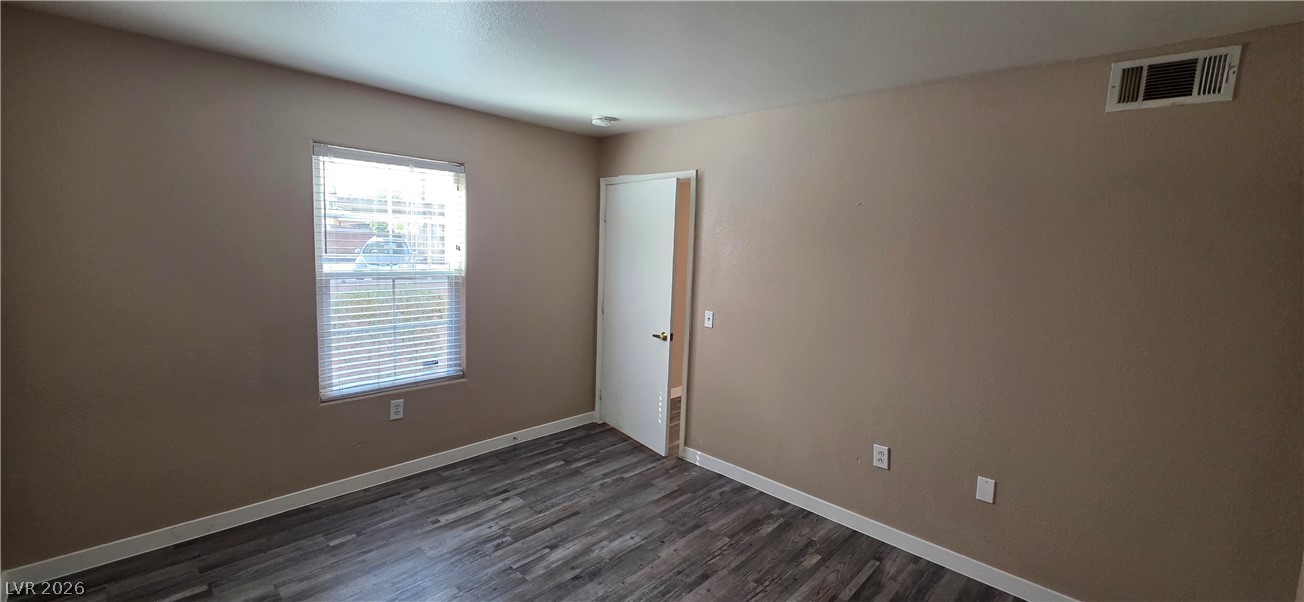 1830 North Pecos Road, Unit 142 Las Vegas, NV 89115 - Photo 5 of 19 A well-lit room showcasing durable flooring and ample natural light through a generous window.