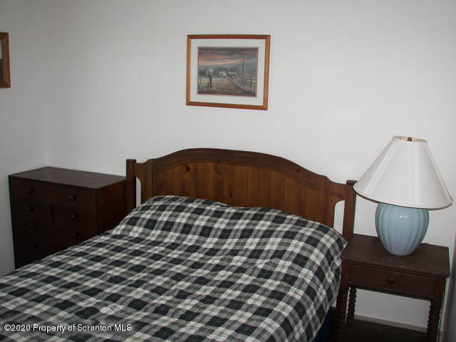 204 Scott Road Union Dale, PA 18470 - Photo 9 of 14 a bedroom with a bed and painting on the wall