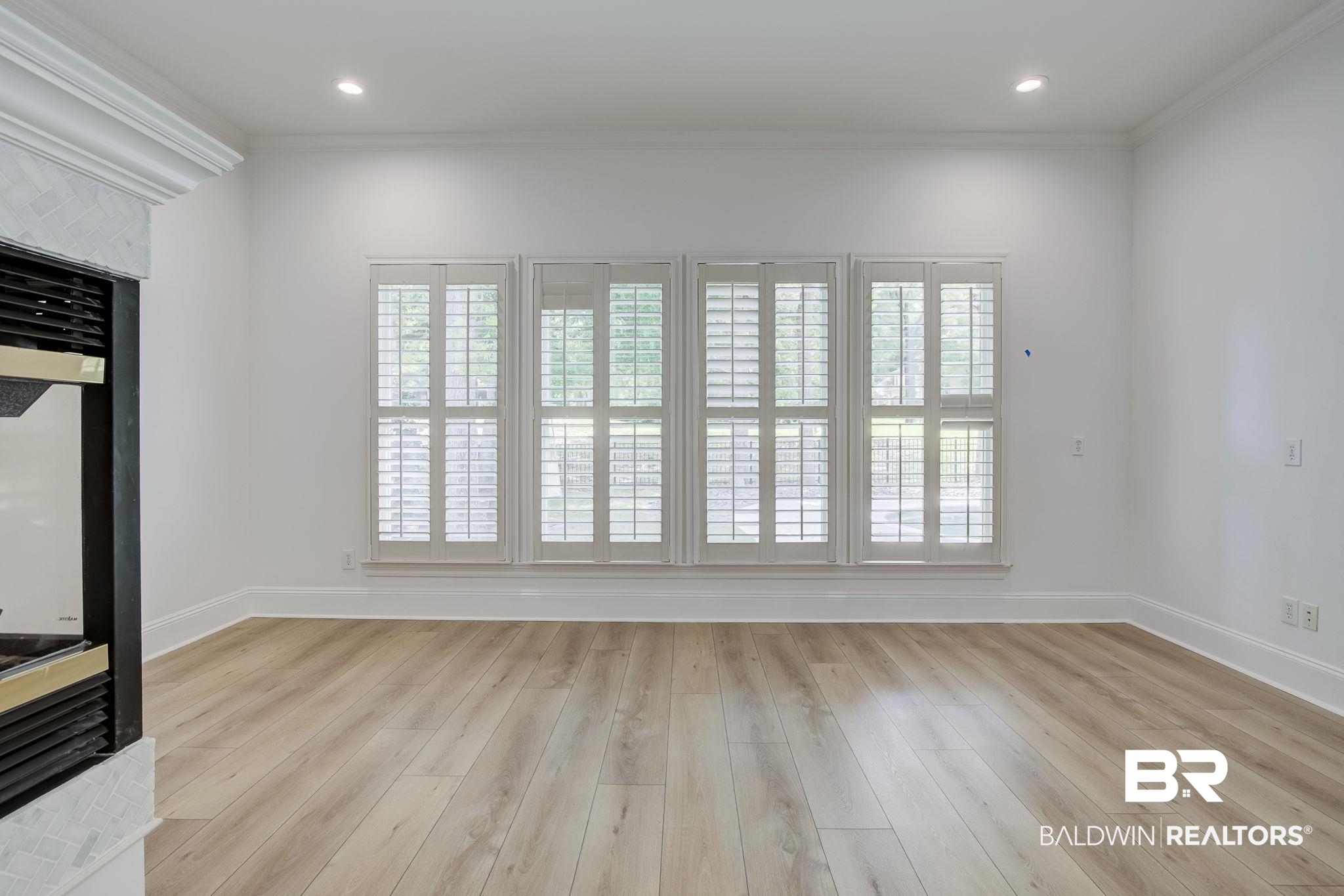 105 High Pines Ridge Fairhope, AL 36532 - Photo 46 of 97 natural light, crown molding, baseboards, and light wood finished floors