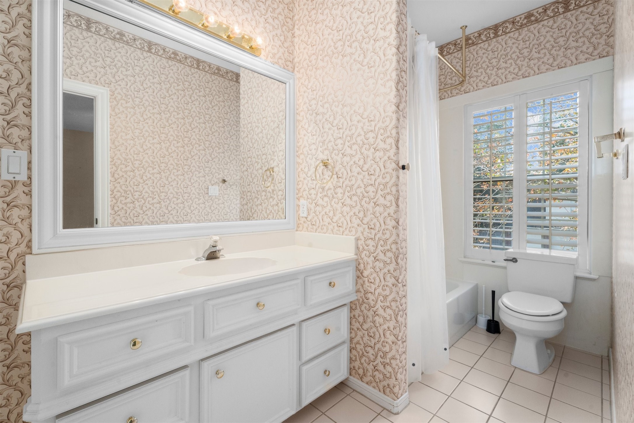 14210 Reissen Lane Houston, TX 77069 - Photo 21 of 34 a spacious bathroom with a granite countertop sink a toilet and a mirror