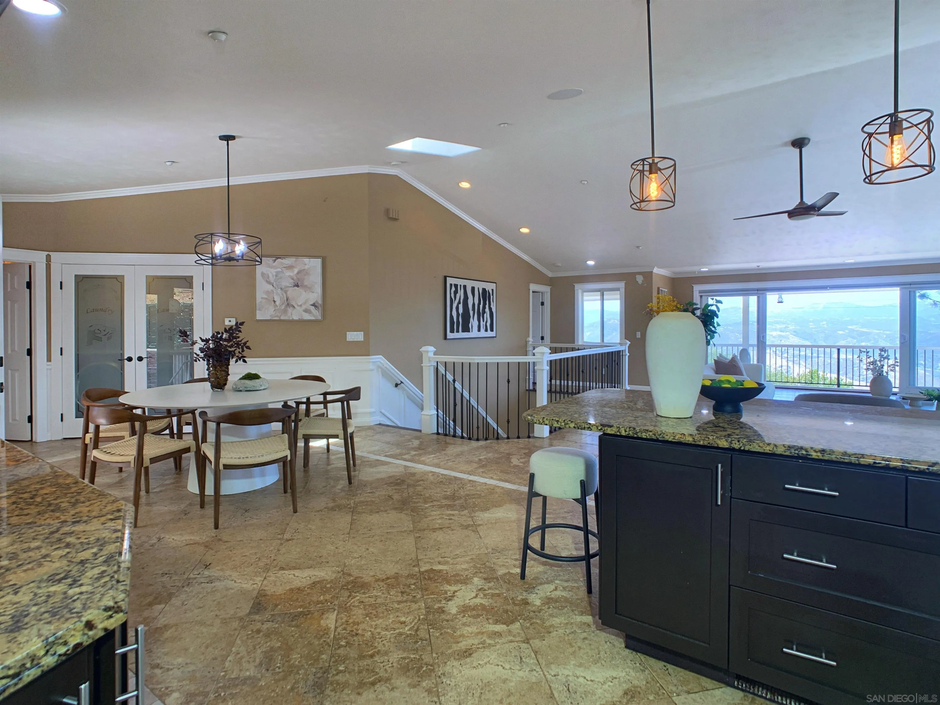 205 Highline Trail El Cajon, CA 92021 - Photo 8 of 45 a kitchen with kitchen island a dining table and chairs