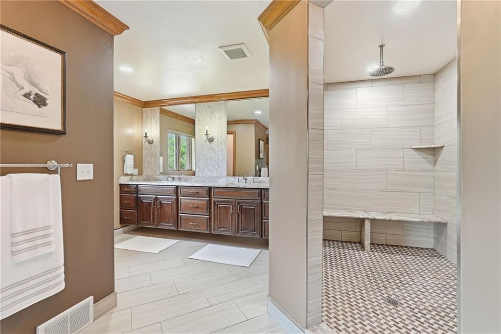 265 McFann Road Valencia, PA 16059 - Photo 26 of 50 a bathroom with a double vanity sink a toilet a shower and a mirror