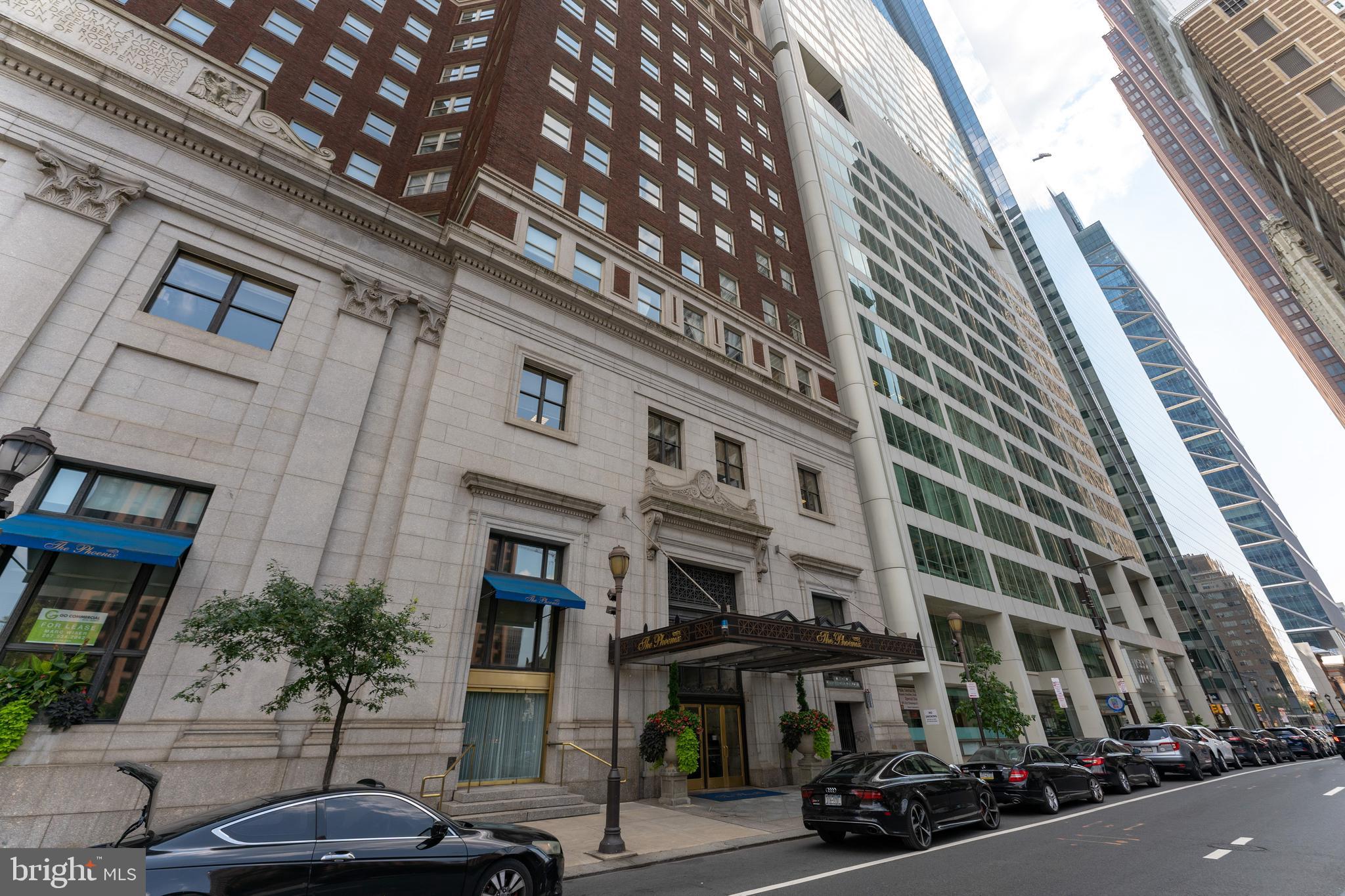 a view of a building with car parked