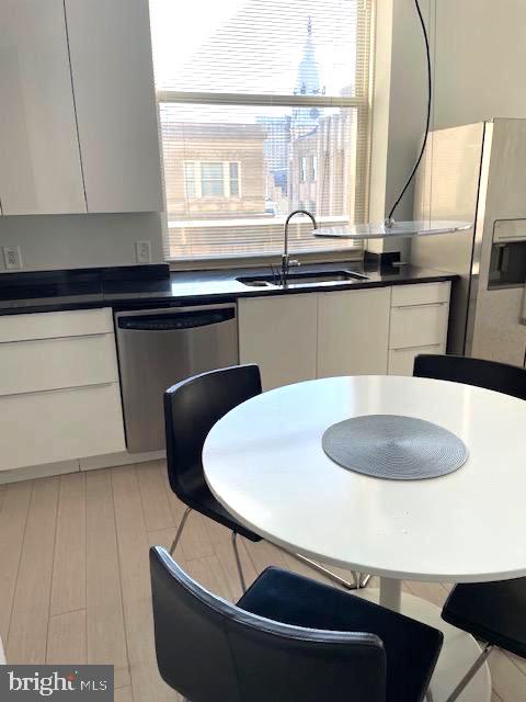 1600 Arch Street, Unit 1904 Philadelphia, PA 19103 - Photo 11 of 21 a kitchen with a sink and a refrigerator