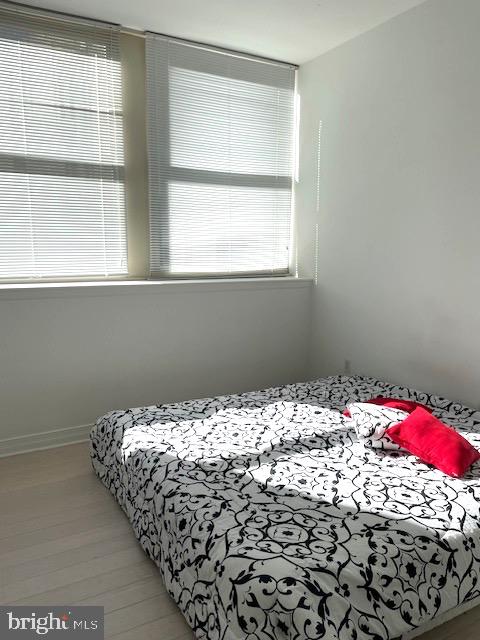 1600 Arch Street, Unit 1904 Philadelphia, PA 19103 - Photo 13 of 21 a bed sitting in a bedroom next to a window