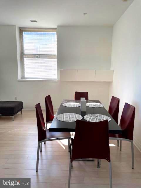 1600 Arch Street, Unit 1904 Philadelphia, PA 19103 - Photo 9 of 21 a view of a dining room with furniture and window