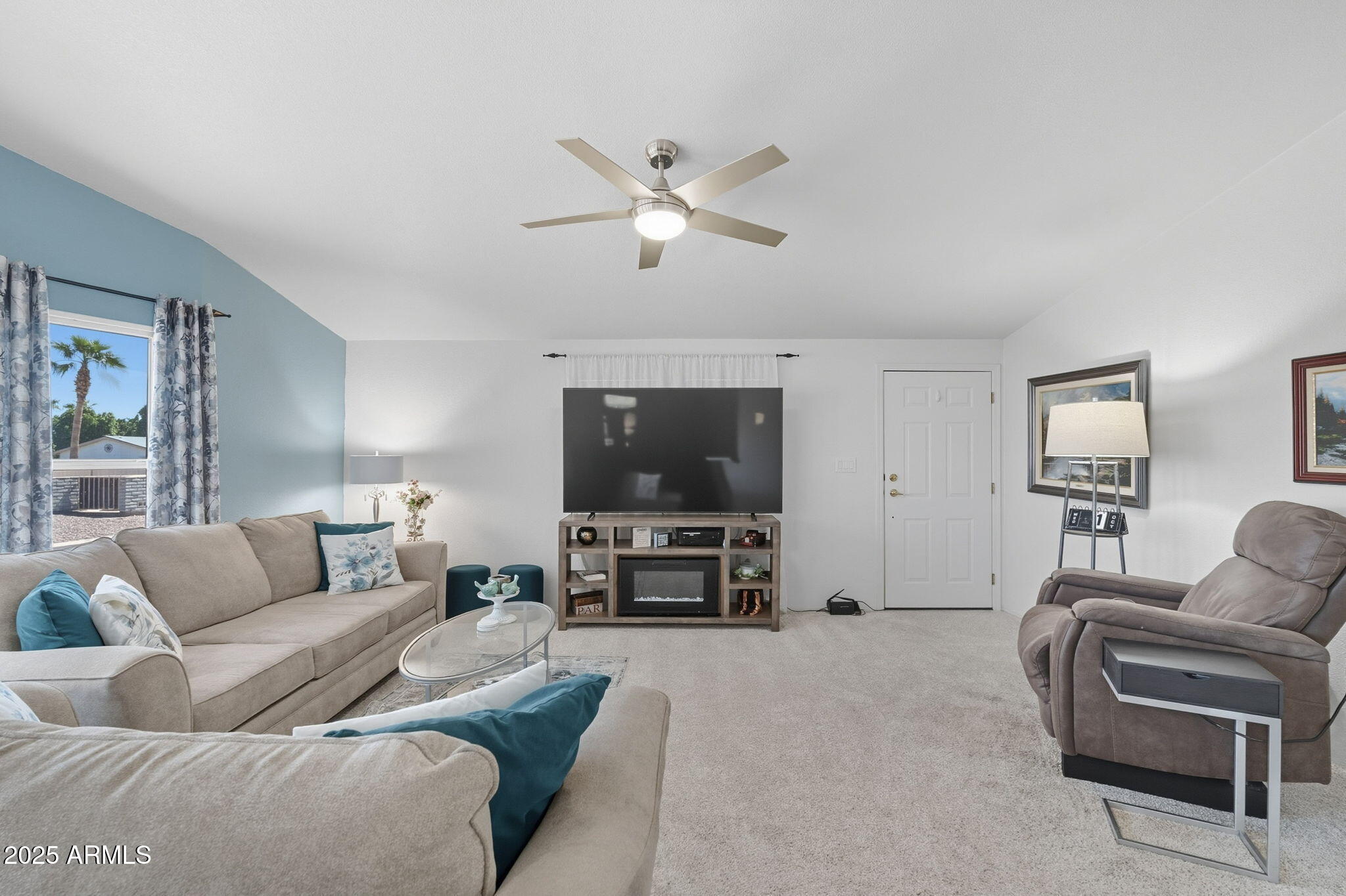 3700 South Tomahawk Road, Unit 39 Apache Junction, AZ 85119 - Photo 15 of 53 a living room with furniture and a flat screen tv