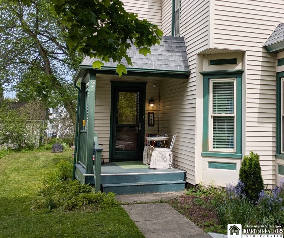 33 Maple Street Ellery, NY 14712 - Photo 2 of 40 The covered front porch with room for a table and