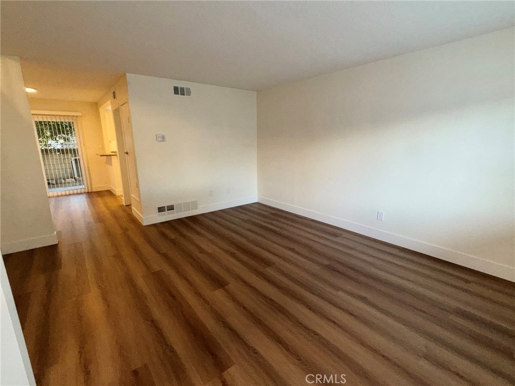 2255 Cahuilla Street, Unit 35 Colton, CA 92324 - Photo 15 of 24 wooden floor in an empty room