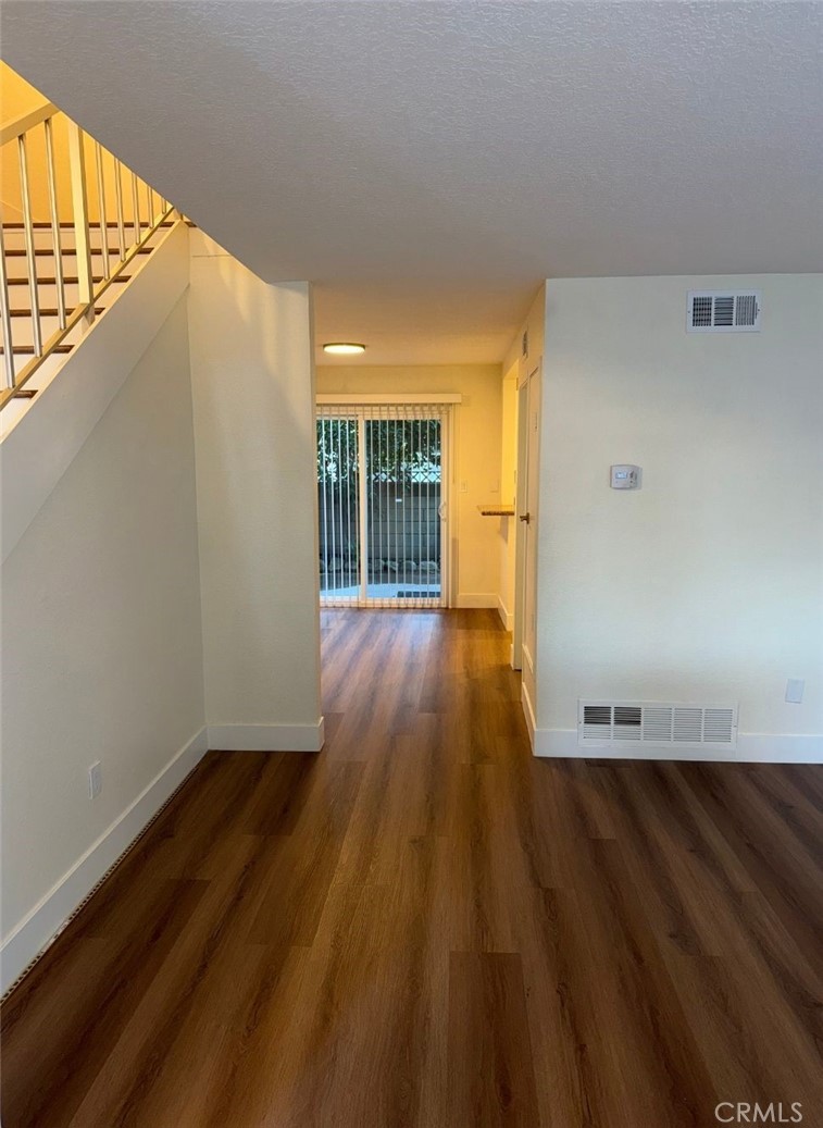 2255 Cahuilla Street, Unit 35 Colton, CA 92324 - Photo 17 of 24 a view of an empty room and wooden floor