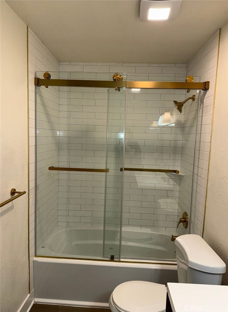 2255 Cahuilla Street, Unit 35 Colton, CA 92324 - Photo 9 of 24 a bathroom with a shower and a toilet