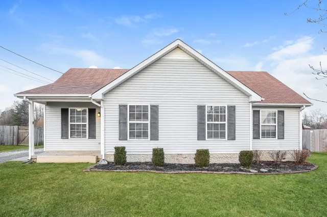 a front view of a house with a yard