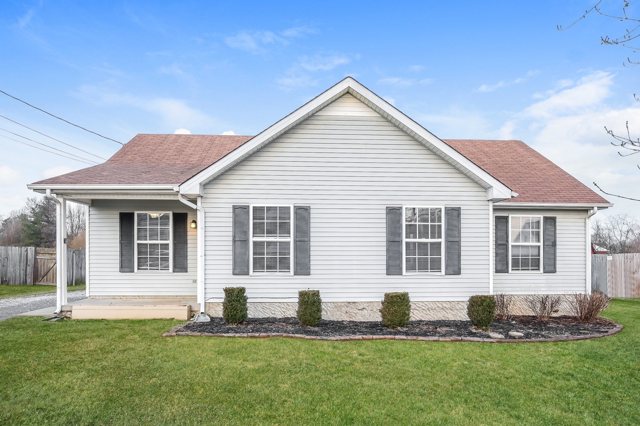a front view of a house with a yard
