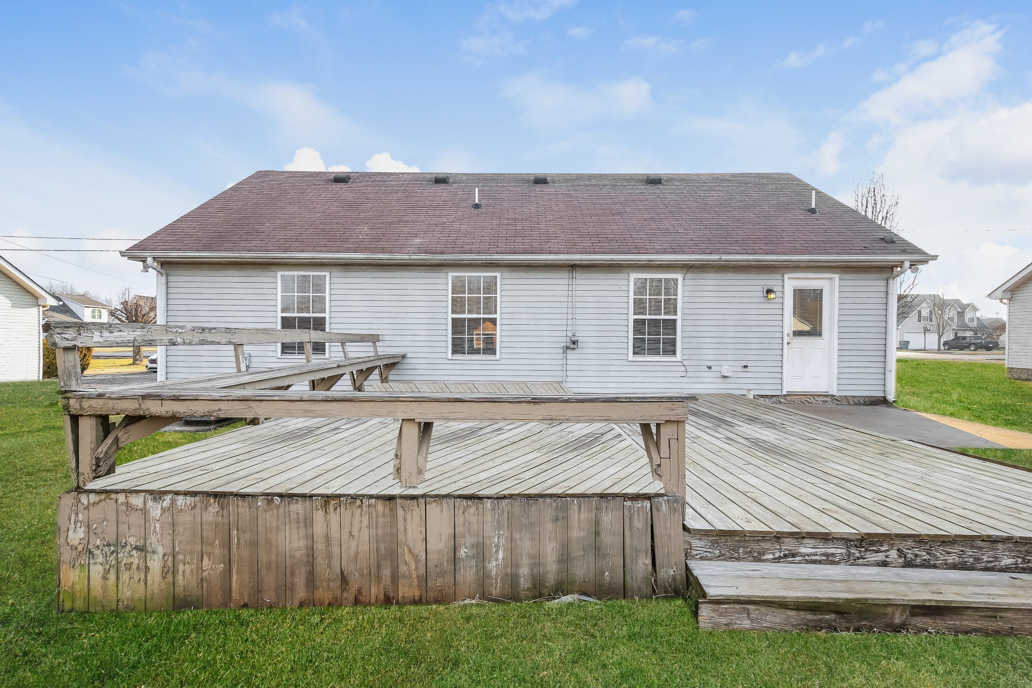 664 Crescent Road Murfreesboro, TN 37128 - Photo 15 of 16 a view of a house with wooden deck and a yard