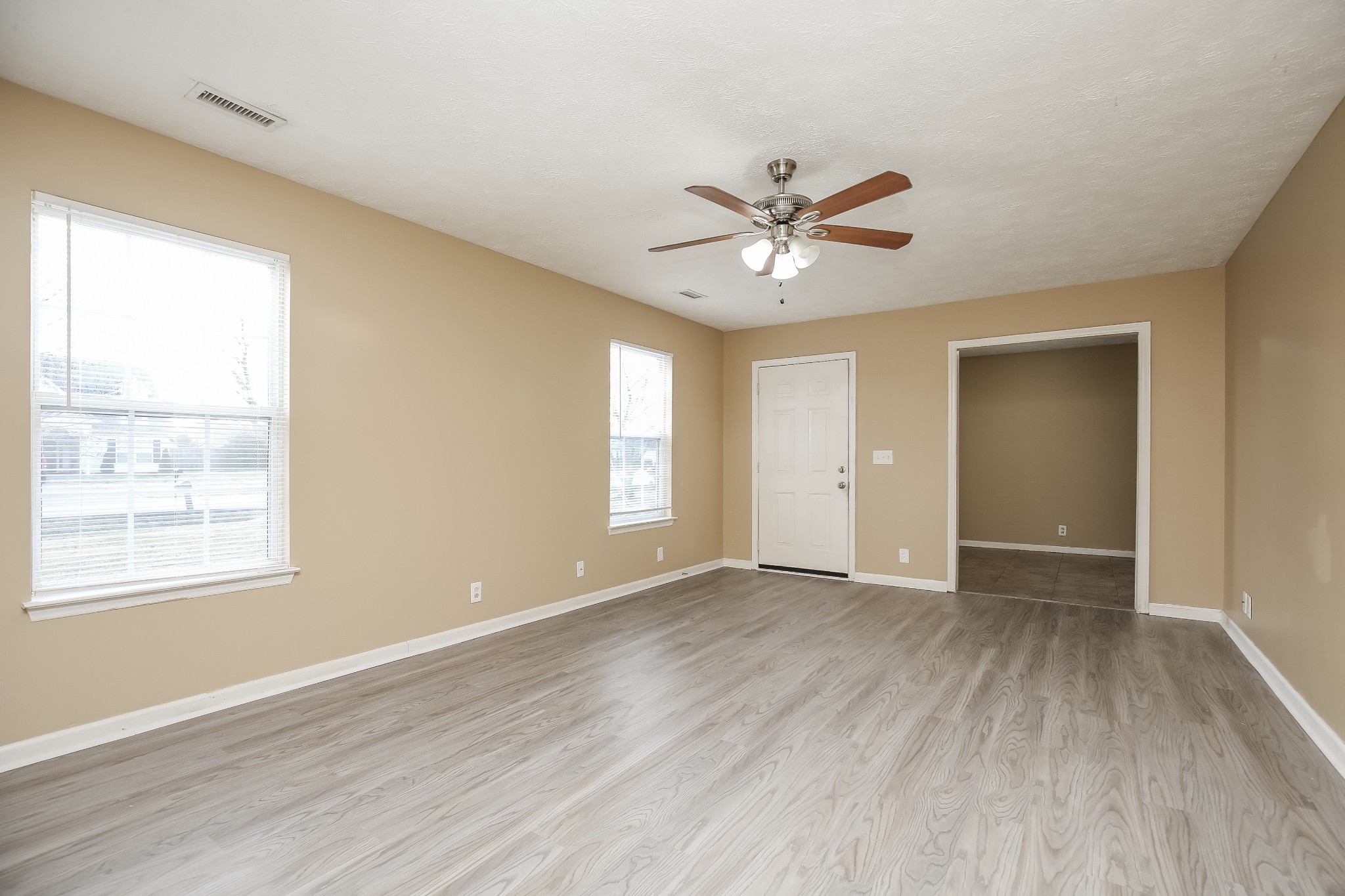 664 Crescent Road Murfreesboro, TN 37128 - Photo 3 of 16 a view of an empty room with a window and wooden floor