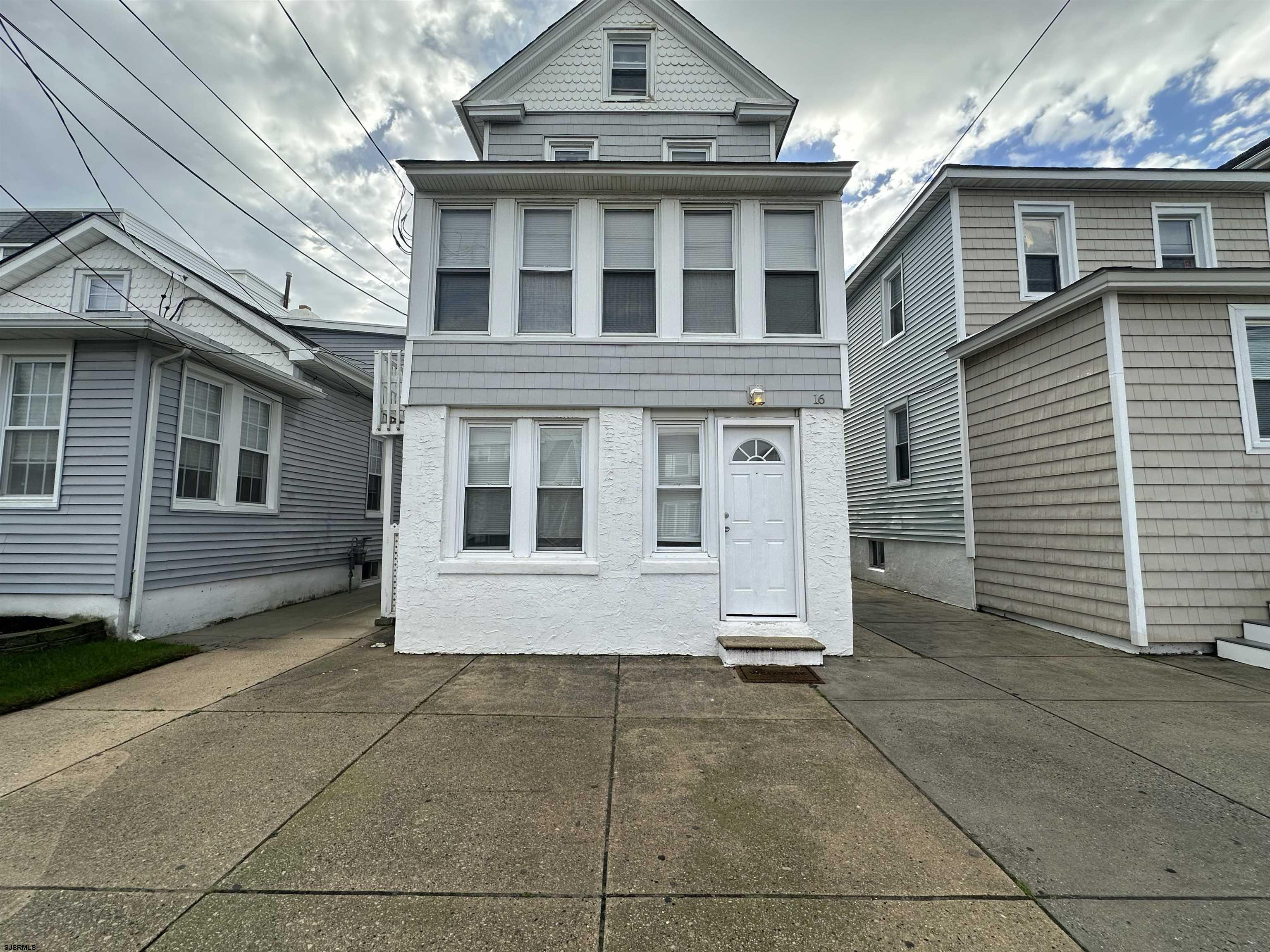 16 South Washington Avenue Margate City, NJ 08402 - Photo 2 of 14 a view of a house with a garage
