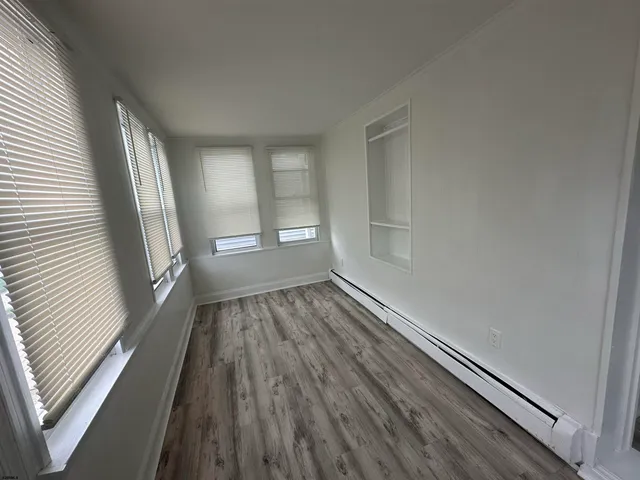 a view of wooden floor in an empty room