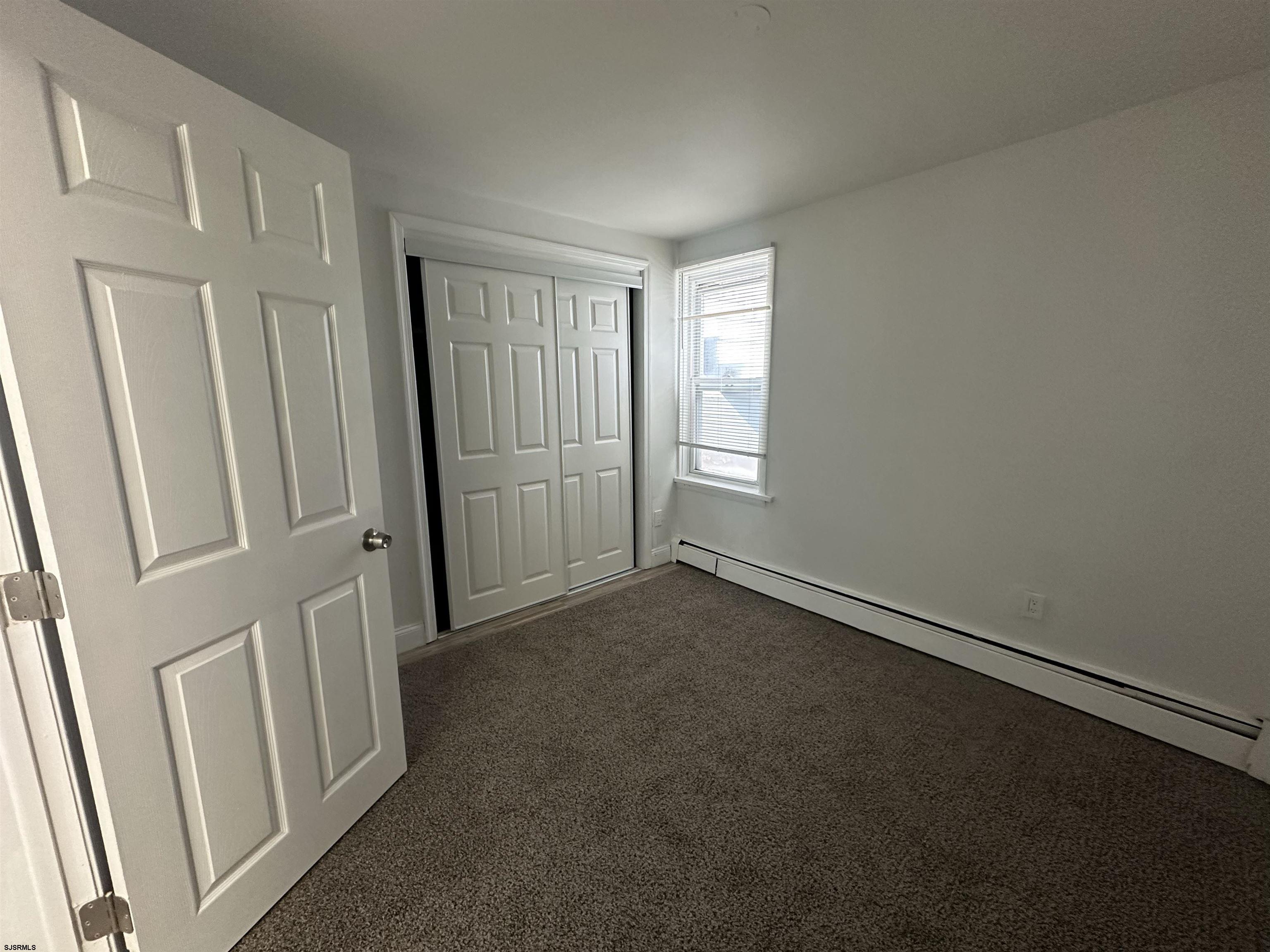 16 South Washington Avenue Margate City, NJ 08402 - Photo 7 of 14 an empty room with windows