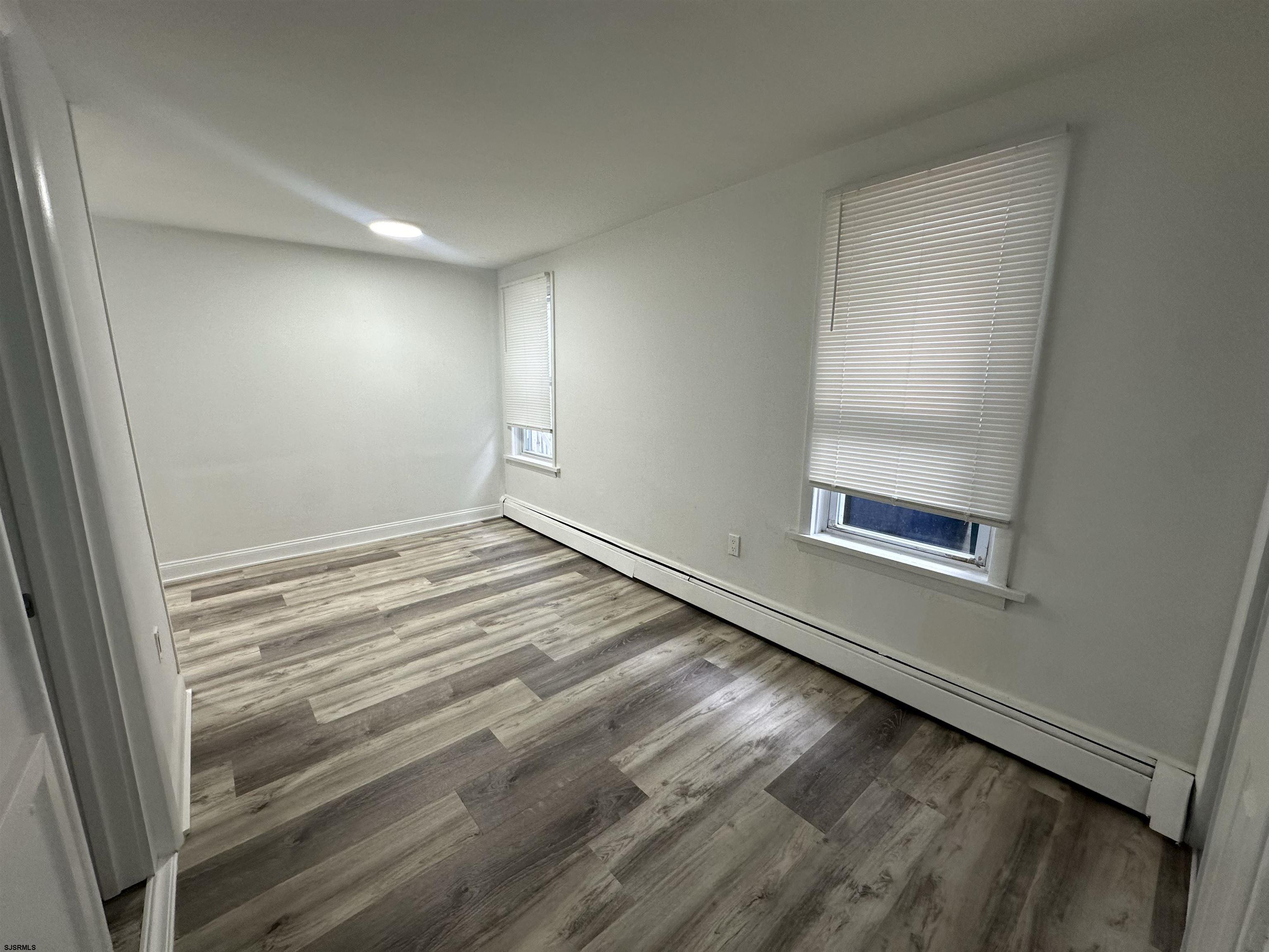 16 South Washington Avenue Margate City, NJ 08402 - Photo 8 of 14 a view of empty room with wooden floor