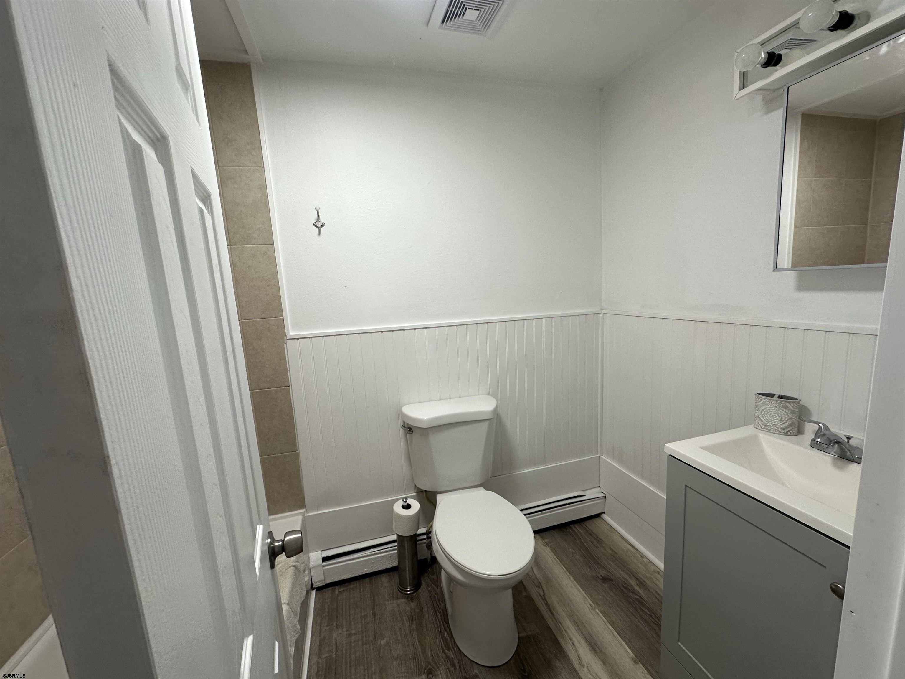 16 South Washington Avenue Margate City, NJ 08402 - Photo 10 of 14 a bathroom with a toilet and a sink