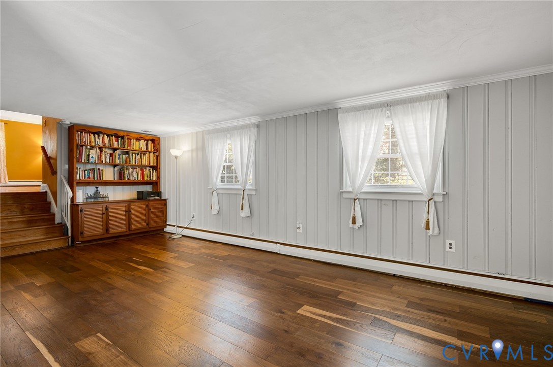 9303 Lawndell Road Henrico, VA 23229 - Photo 11 of 33 an empty room with wooden floor and door