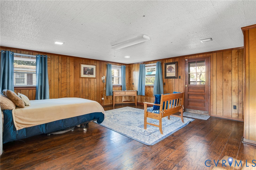 9303 Lawndell Road Henrico, VA 23229 - Photo 15 of 33 a bedroom with bed and wooden floor