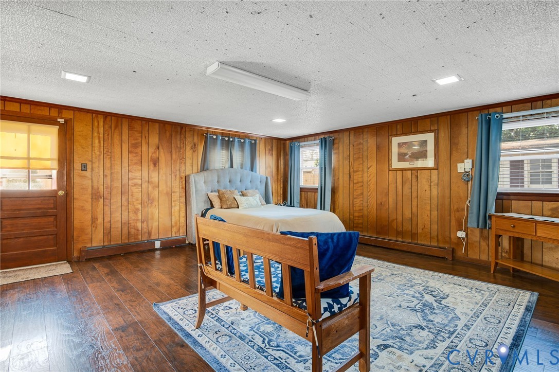 9303 Lawndell Road Henrico, VA 23229 - Photo 16 of 33 a blue bed sitting in a room next to a window