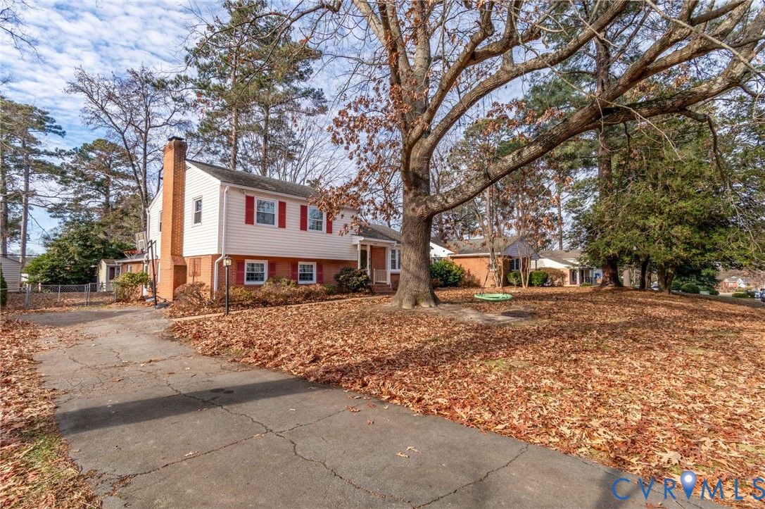 9303 Lawndell Road Henrico, VA 23229 - Photo 20 of 33 a view of a house with a yard covered in snow
