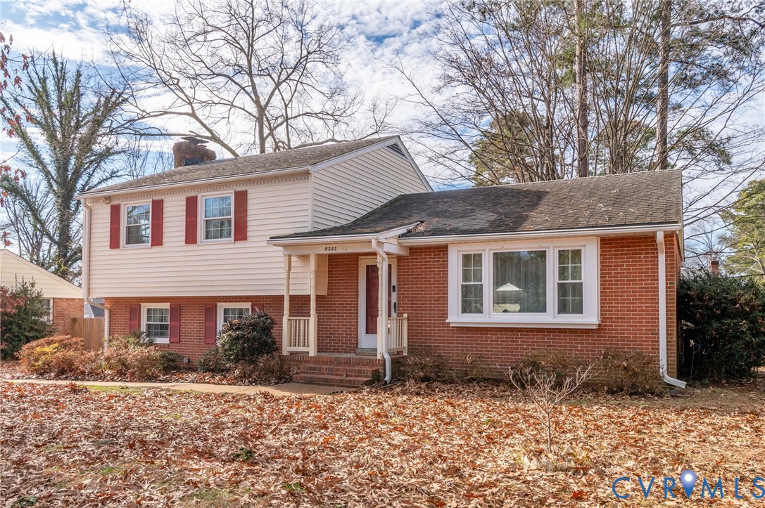 9303 Lawndell Road Henrico, VA 23229 - Photo 2 of 33 a front view of a house with a yard