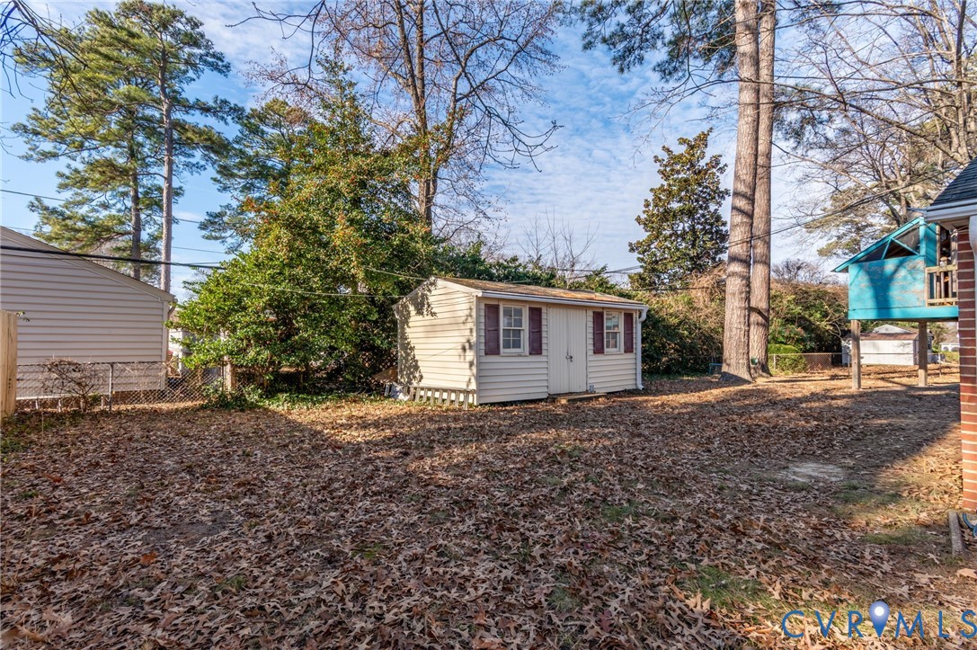 9303 Lawndell Road Henrico, VA 23229 - Photo 22 of 33 a view of a house with a yard