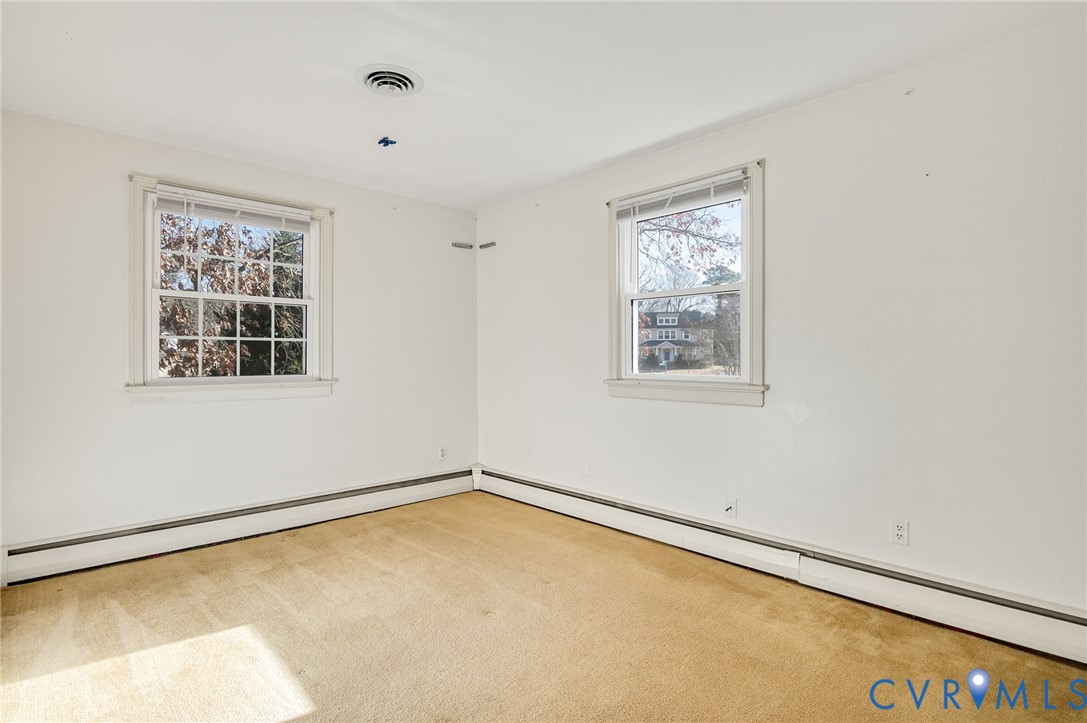 9303 Lawndell Road Henrico, VA 23229 - Photo 29 of 33 wooden floor in an empty room with a window