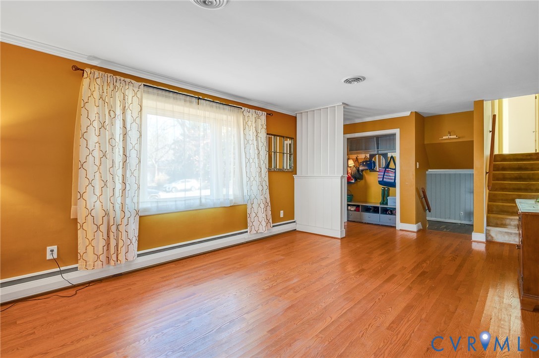 9303 Lawndell Road Henrico, VA 23229 - Photo 5 of 33 an empty room with wooden floor and a window