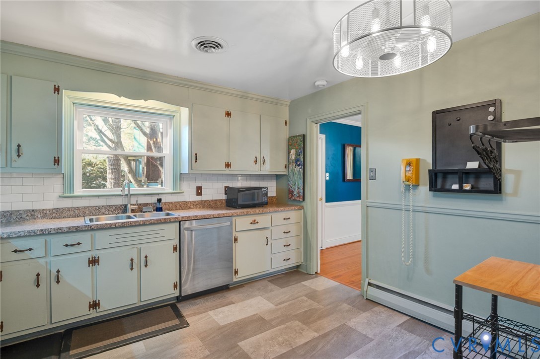 9303 Lawndell Road Henrico, VA 23229 - Photo 9 of 33 a large kitchen with stainless steel appliances granite countertop a sink and cabinets