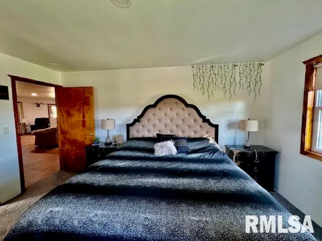 a bathroom with a sink mirror and toilet