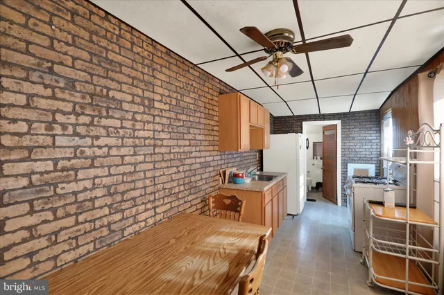 a kitchen that has a sink and a table in it