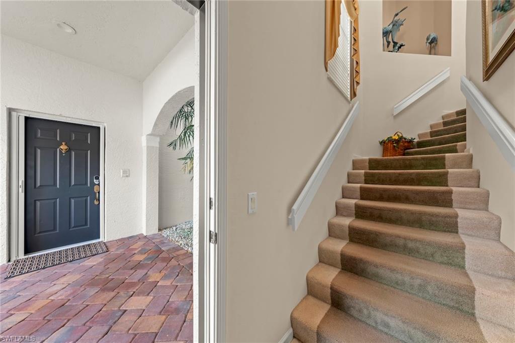 23101 Rosedale Drive, Unit 202 Estero, FL 34135 - Photo 17 of 49 a view of entryway and hall with wooden floor