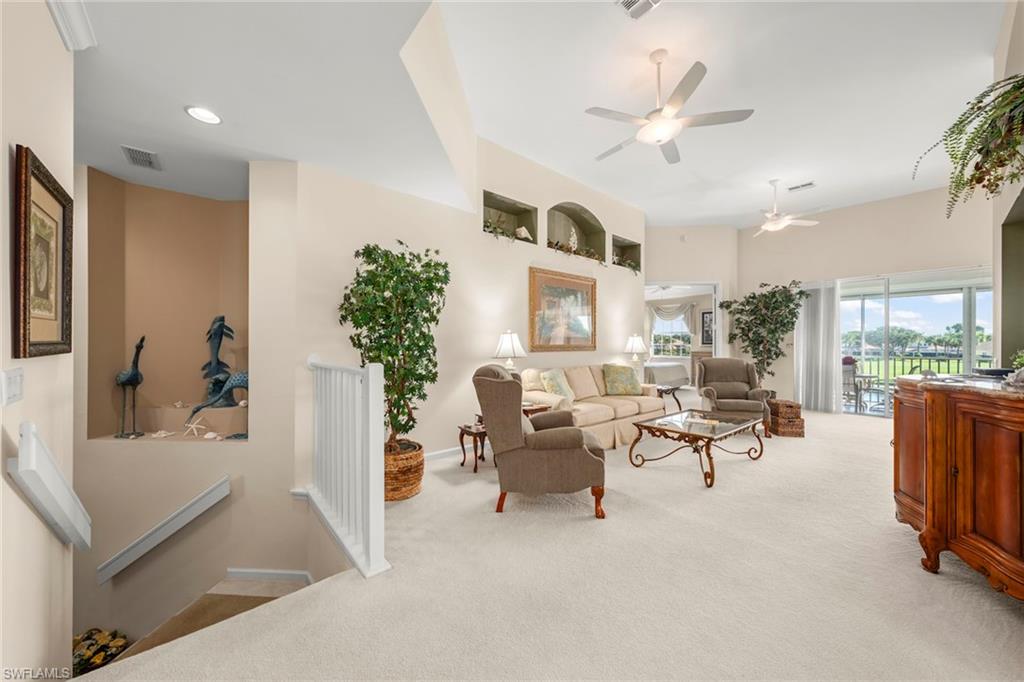 23101 Rosedale Drive, Unit 202 Estero, FL 34135 - Photo 19 of 49 a living room with furniture and a large window