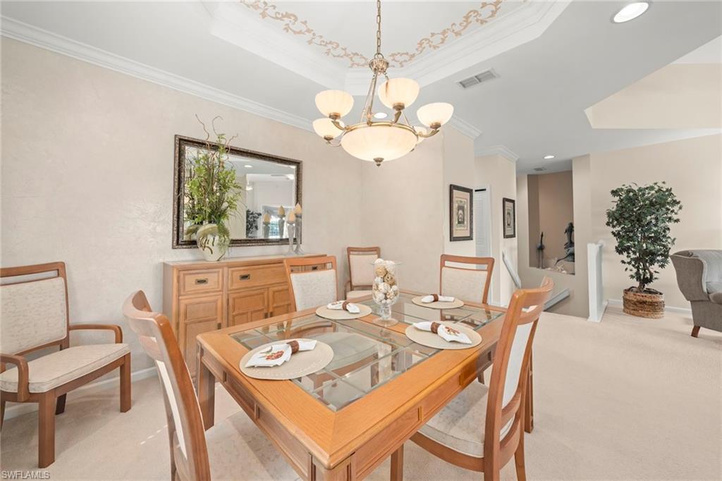 23101 Rosedale Drive, Unit 202 Estero, FL 34135 - Photo 21 of 49 a view of a dining room with a table and chairs