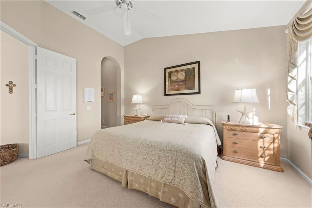 23101 Rosedale Drive, Unit 202 Estero, FL 34135 - Photo 25 of 49 a spacious bedroom with a bed and a cabinets