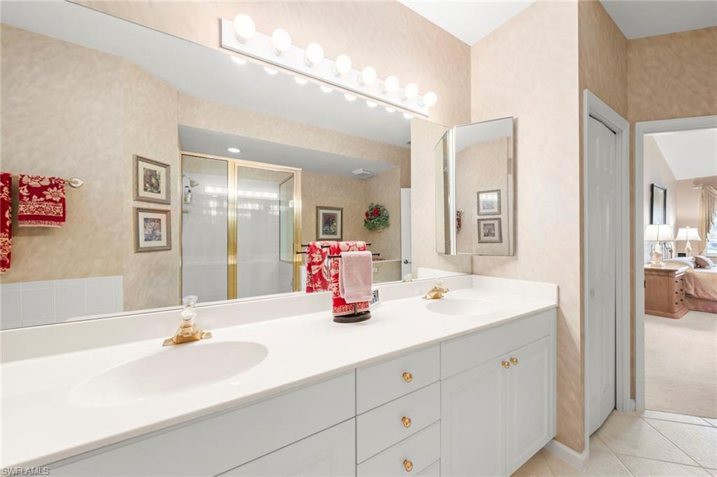 23101 Rosedale Drive, Unit 202 Estero, FL 34135 - Photo 27 of 49 a bathroom with a sink double vanity
