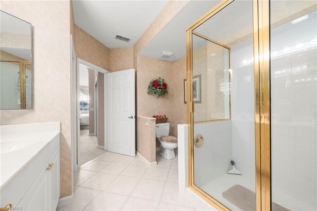 23101 Rosedale Drive, Unit 202 Estero, FL 34135 - Photo 28 of 49 a bathroom with a shower and a tub
