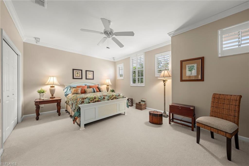 23101 Rosedale Drive, Unit 202 Estero, FL 34135 - Photo 30 of 49 a bedroom with a bed and a couch