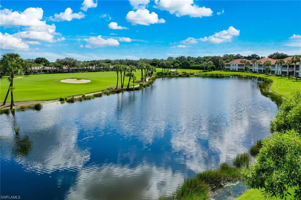 23101 Rosedale Drive, Unit 202 Estero, FL 34135 - Photo 40 of 49 a view of a lake with a city