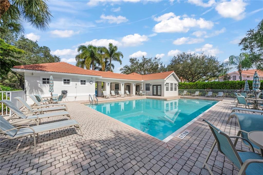 23101 Rosedale Drive, Unit 202 Estero, FL 34135 - Photo 41 of 49 a view of a house with backyard porch and sitting area
