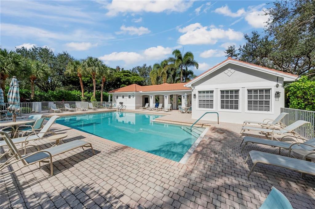 23101 Rosedale Drive, Unit 202 Estero, FL 34135 - Photo 48 of 49 a view of a house with backyard porch and sitting area