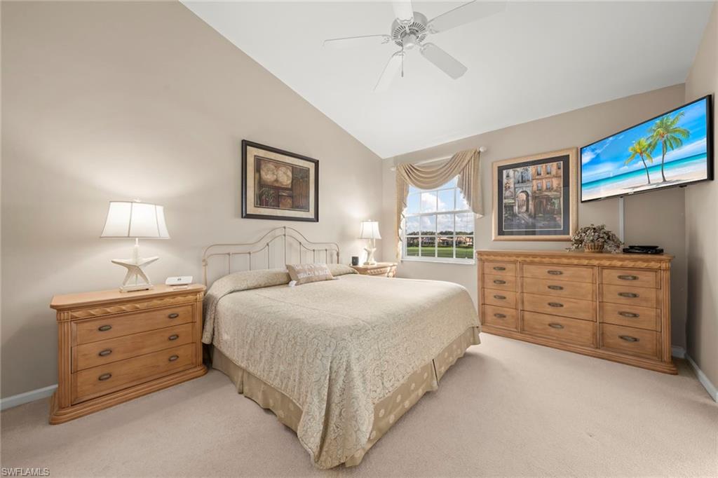 23101 Rosedale Drive, Unit 202 Estero, FL 34135 - Photo 6 of 49 a spacious bedroom with a bed and a dresser