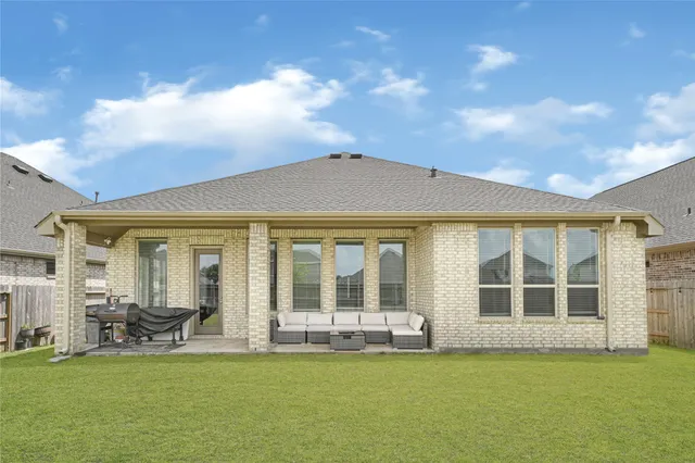 a view of a house with swimming pool and porch