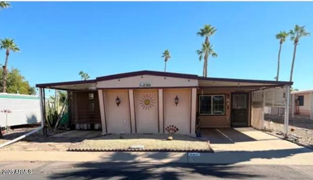 2100 North Trekell Road Casa Grande, AZ 85122 - Photo 1 of 21 a view of a house with potted plants
